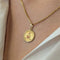 Pendentif Augis en or jaune diamant et rubis