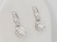 Boucles d'oreilles Paire de dormeuses anciennes en or blanc et diamants 58 Facettes 32108