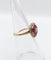 Bague 48 Bague fleur art deco or rose 18k ornée d'un diamant taille brillant entouré de rubis calibrés dans une monture finement travaillée (circa 1920) 58 Facettes A04432