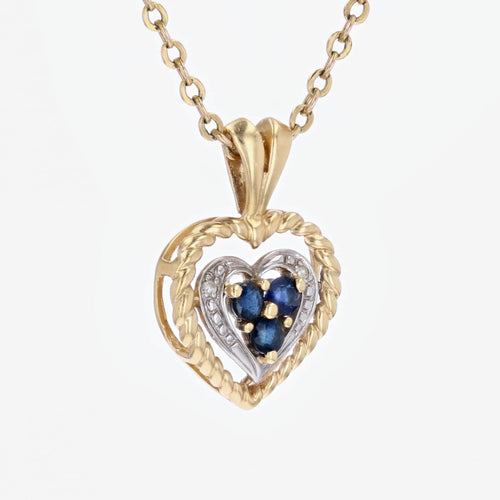 Pendentif Pendentif coeur ors jaune et blanc saphir d'occasion 58 Facettes 15-036