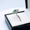 Bague 53 Bague marquise or gris, émeraude, diamant 58 Facettes