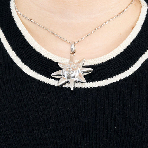 Pendentif Pendentif soleil en or gris 58 Facettes CAN1103