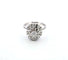 Bague 53 Bague en or blanc avec diamant central et diamants environnants 58 Facettes