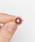 Bague 48 Bague fleur art deco or rose 18k ornée d'un diamant taille brillant entouré de rubis calibrés dans une monture finement travaillée (circa 1920) 58 Facettes A04432