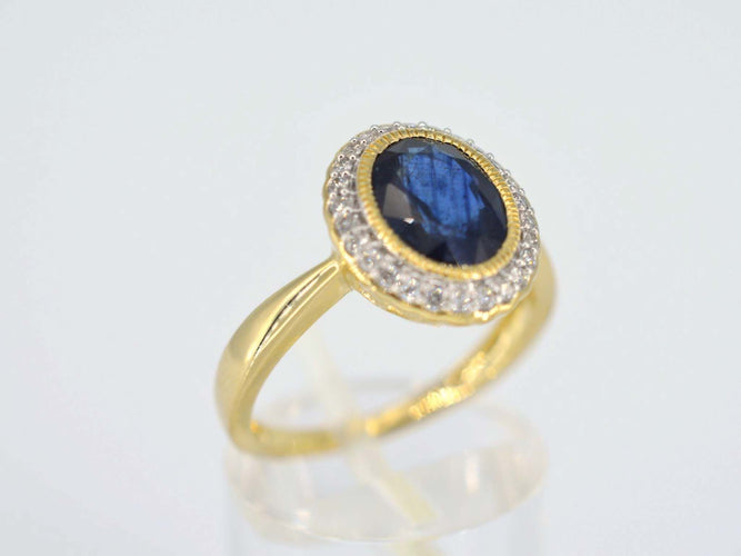 Bague 54 Bague entourage en or avec diamants et saphir 58 Facettes 2142