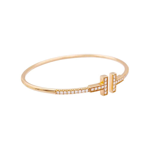 Bracelet Bracelet Tiffany "Wire Tiffany T" en or rose et diamants. 58 Facettes 34827