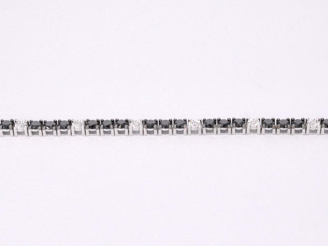 Bracelet Bracelet de tennis en or blanc serti de diamants noirs et blancs 58 Facettes 2119