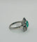 Bague 59 Bague en platine avec une émeraude, des diamants et des saphirs. 58 Facettes 50230
