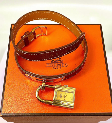 Montre Montre Hermès «  Kelly », cadran PM plaqué or, double tour cuir marron 58 Facettes AB453