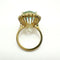 Bague 55 Bague en or jaune de haute joaillerie ornée d'une aigue-marine et d'un halo de diamants 58 Facettes 50357