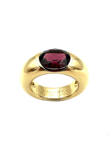 Bague 51 CARTIER. Collection "Ellipse", bague or jaune et grenat 58 Facettes