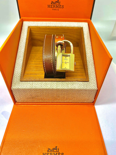 Montre Montre Hermès «  Kelly », cadran PM plaqué or, double tour cuir marron 58 Facettes AB453