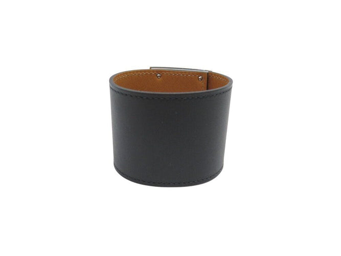 Bracelet bracelet HERMES extreme kelly dog manchette en cuir noir 50mm 58 Facettes 267199
