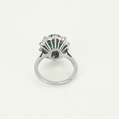 Bague 50 Bague marguerite en or blanc, émeraude et diamants 58 Facettes B250523