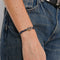 Bracelet DINH VAN - Bracelet Menottes en argent et cordon bleu 58 Facettes 98251