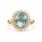 Bague 55 Bague en or jaune de haute joaillerie ornée d'une aigue-marine et d'un halo de diamants 58 Facettes 50357