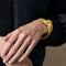 HERMES - Bracelet jonc en or jaune a motif de cheval