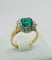 Bague Bague en or jaune et platine, ornée d'une émeraude centrale et d'un halo de diamants. Style Art déco. 58 Facettes 50243