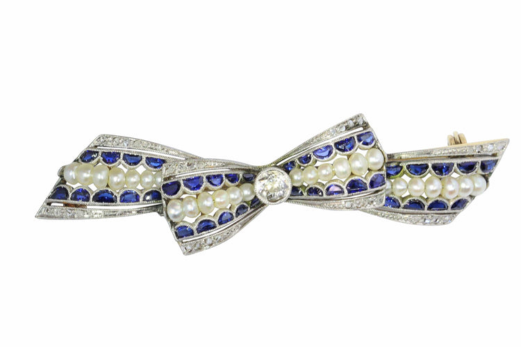 Broche Broche nœud vintage des années 1910 en saphirs et perles – Belle Époque Grace 58 Facettes 25191-0322