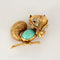 Broche Van Cleef & Arpels  Rare Broche animalière à décor d'Ecureuil en platine et or jaune, diamants, rubis et cabochon de turquoise. 58 Facettes HOU5762