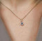 Pendentif Pendentif entourage saphir bleu ovale et diamants en or jaune 18k 58 Facettes 2505001