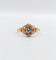 Bague marguerite antique or rose ornée d'un diamant entouré de diamant et épaulé de petits cœurs