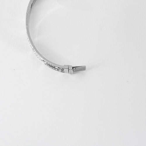Bracelet DINH VAN - Pulse - Bracelet or blanc et diamants 58 Facettes MEA43043