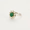Bague 55 Bague Marguerite or gris et jaune, diamants et émeraude 58 Facettes 250256