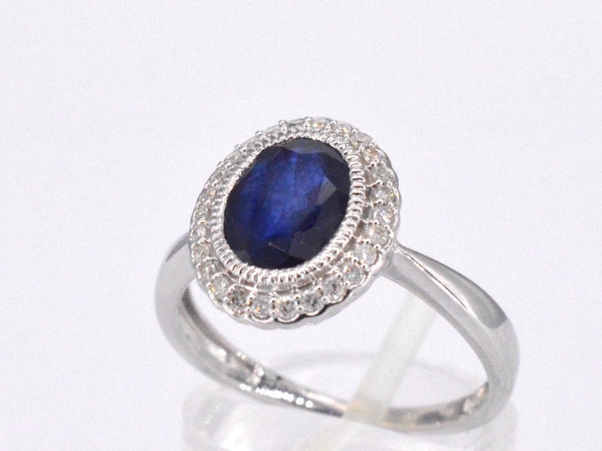Bague 54 Bague entourage en or blanc avec diamants et saphir 58 Facettes 2044