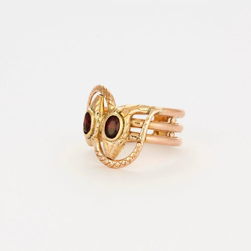 Bague 64 Bague or bicolore motif serpent et grenats 58 Facettes AB44