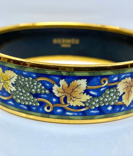 Bracelet HERMÈS - bracelet en métal doré et émail 58 Facettes AB657