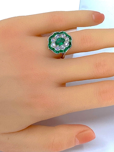 Bague Bague marguerite en or blanc 18 carats en émeraudes et diamants 58 Facettes AB216