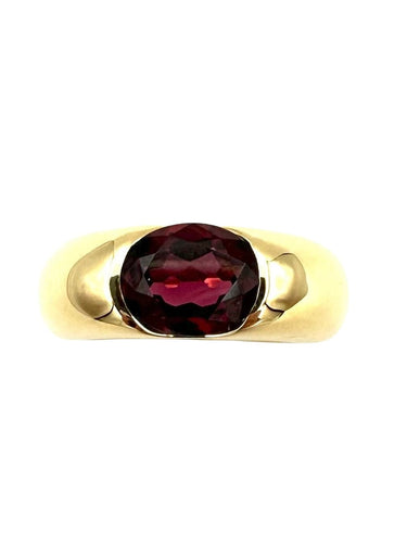Bague 51 CARTIER. Collection "Ellipse", bague or jaune et grenat 58 Facettes