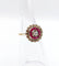 Bague 48 Bague fleur art deco or rose 18k ornée d'un diamant taille brillant entouré de rubis calibrés dans une monture finement travaillée (circa 1920) 58 Facettes A04432