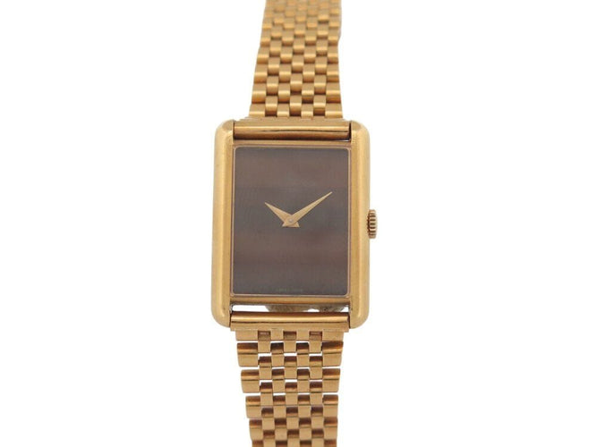 Montre vintage montre baume & mercier tank 37077 mecanique or 18k & oeil de tigre 58 Facettes 268283