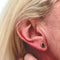 Boucles d'oreilles Boucles d'oreilles au design contemporain en or jaune avec émeraude 58 Facettes Q293B