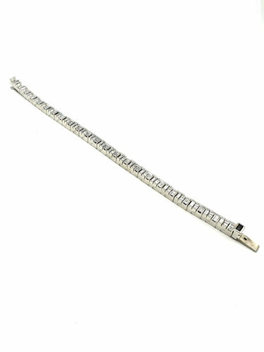 Bracelet CANTURI. Bracelet or balnc 18K et diamants baguettes. 58 Facettes