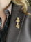 Broche Broche passementerie or jaune rubis calibrés 58 Facettes 1159.3