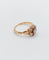 Bague marguerite antique or rose ornée d'un diamant entouré de diamant et épaulé de petits cœurs
