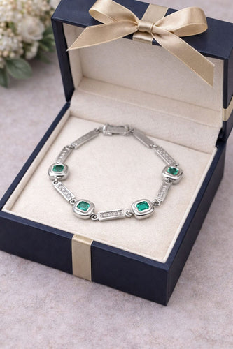 Bracelet Bracelet en or blanc à maillons rectangulaires, diamants et émeraudes 58 Facettes 50399