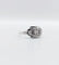 Bague 53 Bague art deco or blanc 18k ornée d'un diamant rond dans une monture géométrique finement travaillée (circa 1930) 58 Facettes A04979