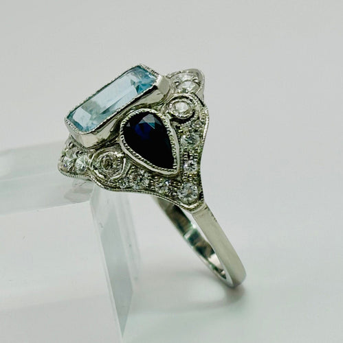 Bague 54 Bague Art Déco en platine ornée d'aigues-marines, de saphirs et de diamants 58 Facettes 50308