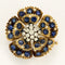 Broche Broche Eglantine en or jaune et or gris 18K, diamants et saphirs 58 Facettes 58FC113