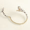 Bracelet Bracelet panthère en or jaune avec onyx, émeraudes et diamants 58 Facettes 62000207