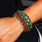 Bracelet Bracelet rétro 1940 en or jaune 18 carats, émeraudes, diamants et rubis 58 Facettes 62800060