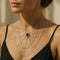 Collier Collier en or gris, grenat et diamants 58 Facettes 63700036