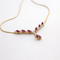Collier Collier en or jaune 18 carats avec diamants et rubis 58 Facettes 34623