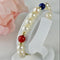 Bracelet Armband en perles, or 14 carats et pierres fines 58 Facettes 2306