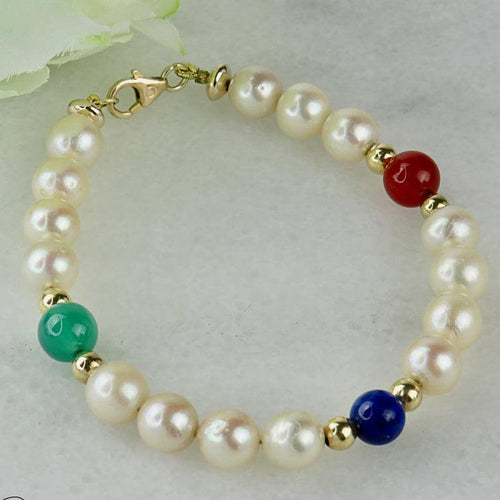 Bracelet Armband en perles, or 14 carats et pierres fines 58 Facettes 2306