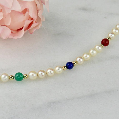 Bracelet Armband en perles, or 14 carats et pierres fines 58 Facettes 2306